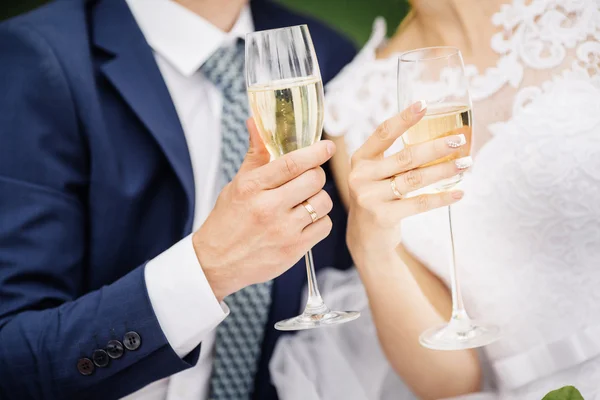 Wedding couple holding wine glasses