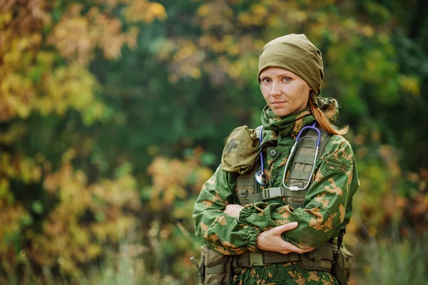 Russian soldier medic in universal camouflage army uniform and s