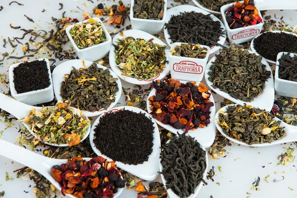 Assortment of dry tea. Various kinds of tea isolated on white.Different kinds of tea leaves. Tea composition with different kind of tea. Tea concept. Tea leaves