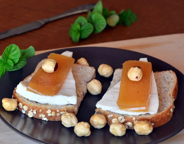 Quince And Fresh White Cheese On Bread Toast On A  Plate