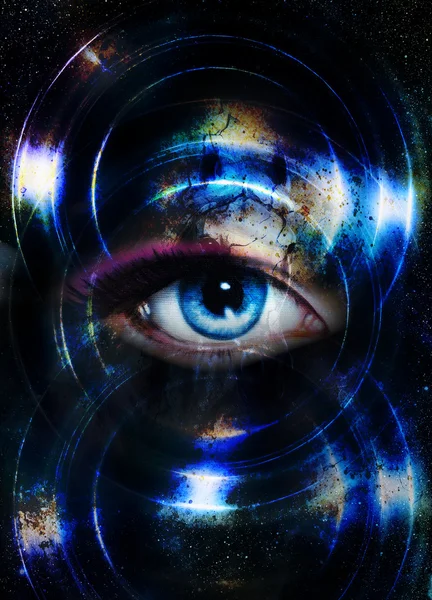 Woman eye and cosmic space, with light circle. blue color.