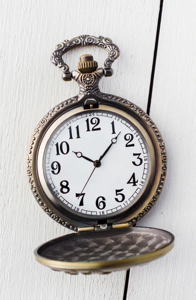 Silver antique clock on a white background