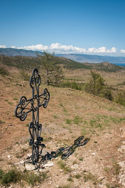 Metal cross on the hill