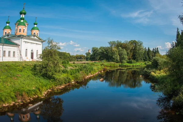 White church on the bank of the river