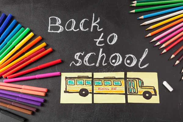 Back to school background with colorful felt tip pens, pencils,  title \