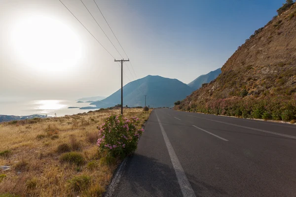 Scenic mountain road and Mediterranean Sea on the background