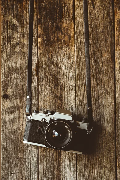 VIntage camera on old background of wood