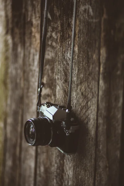 VIntage camera on old background of wood