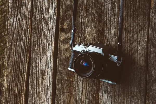 VIntage camera on old background of wood