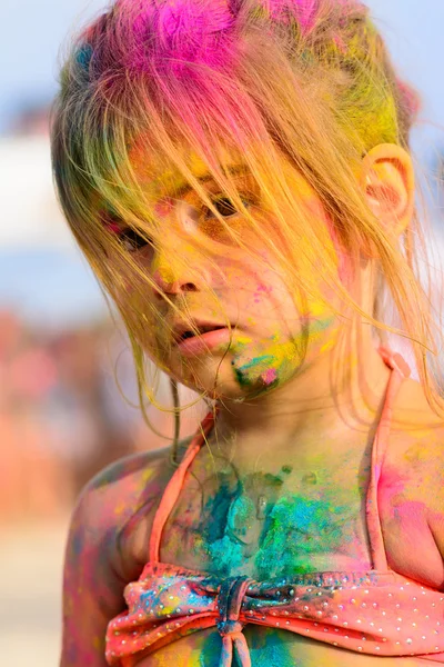 Cte young little girl with colored face, beach party