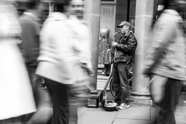 Street saxophonist, black and white