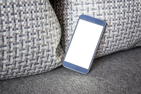 Modern Smartphone mockup with blank screen on sofa