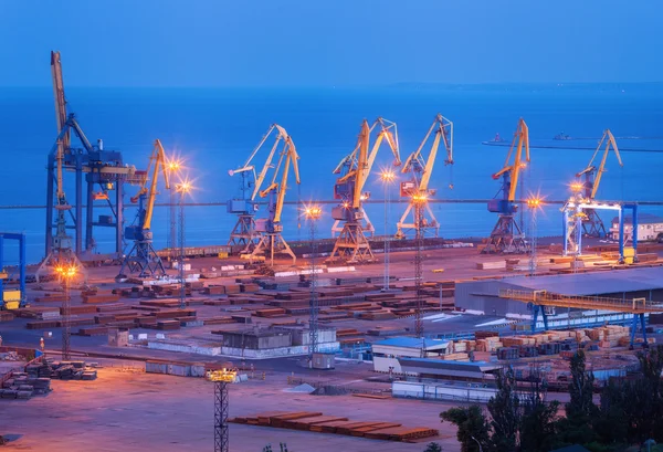 Sea commercial port at night in Mariupol, Ukraine. Industrial la