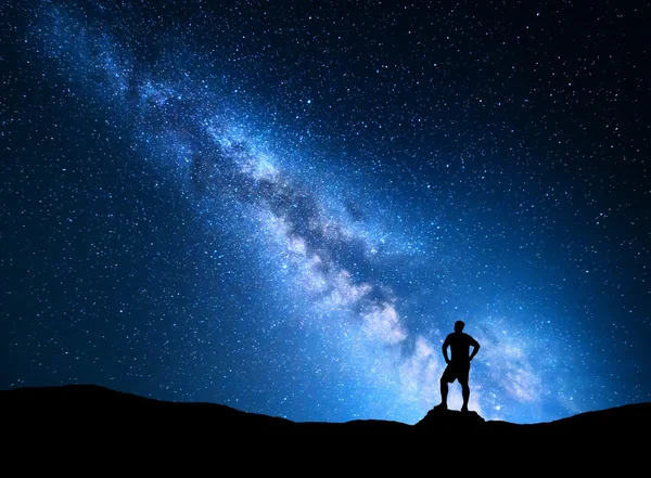 Milky Way and silhouette of a man. Night landscape
