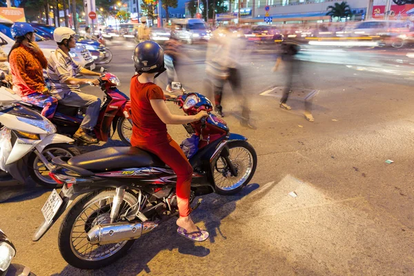 Motorbike drivers at the crossroad, Ho Chi Minh City, Vietnam