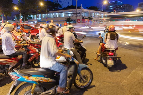 Motorbike drivers at the crossroad, Ho Chi Minh City, Vietnam