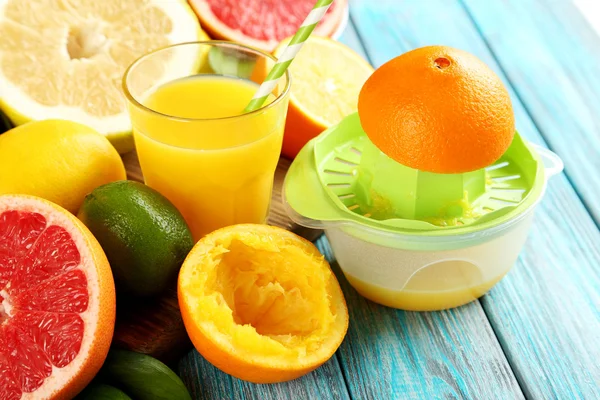 Citrus fruits with juicer