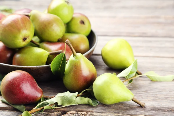 Ripe pears on table