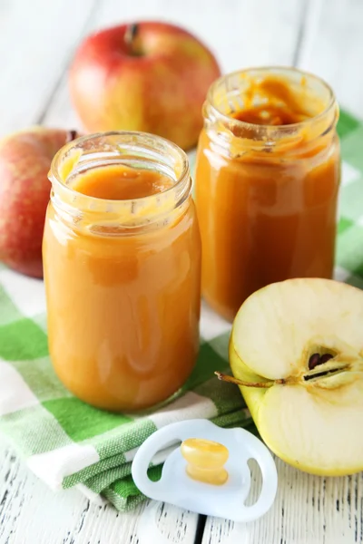 Jars of baby puree with apples