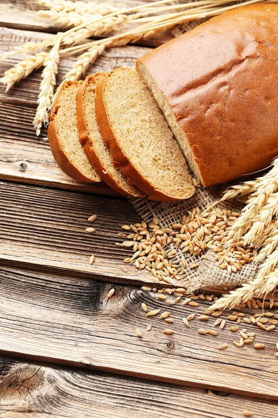 Ears of wheat with wheat grains and bread