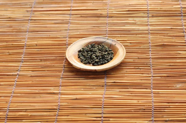 Dry herb tea on wood plate