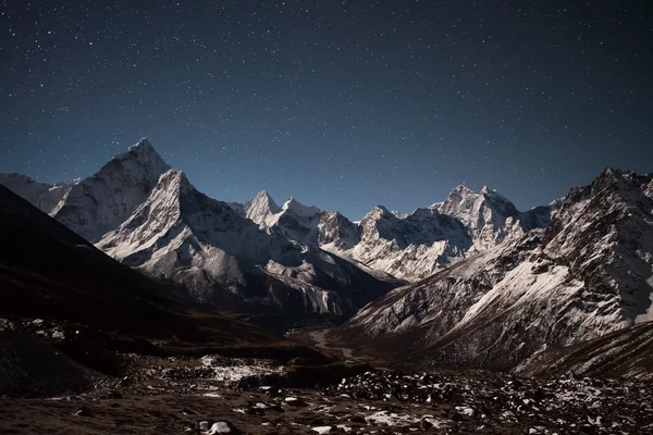 Ama Dablam mountain panoramic view on a starry night.