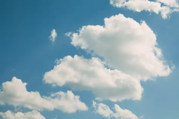 White clouds blue sky landscape. Idyllic weather concept.