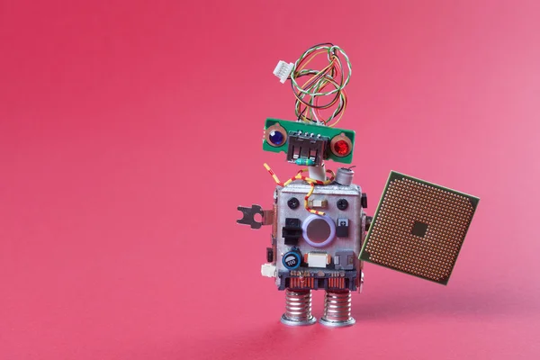 Robot electronic chip board. vintage design toy mechanism with funny head, electrical wire hairstyle, colorful blue red eyes. Copy space, pink gradient background