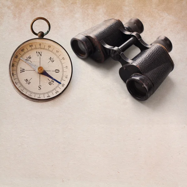 Vintage compass, aged binocular.