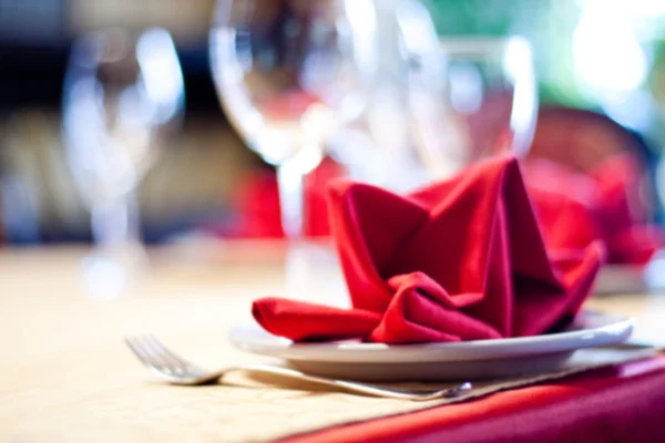 Abstract blurred served table. Romantic restaurant interior. colorful still life and service concept photography