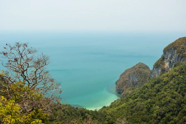 View of hilly island, coastline & ocean in Thailand