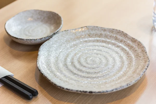 Empty spiral pattern plate on wood table