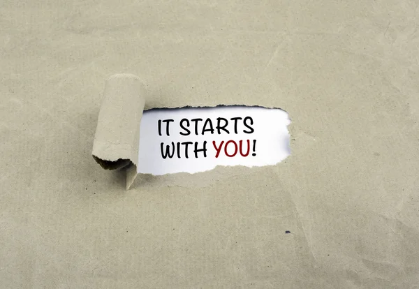 Inscription revealed on old paper - It Starts With You!