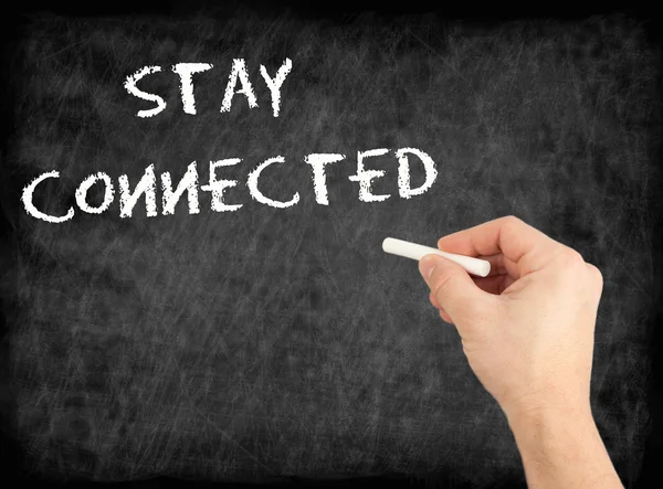 Stay Connected - hand writing text on chalkboard