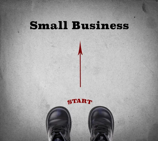 Top view of boots on grey ground with text Small business