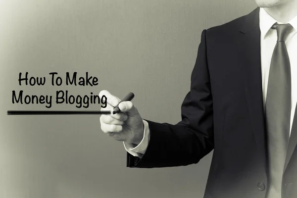 Business man writing - How to make money blogging