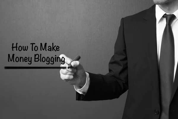 Business man writing How to make money blogging