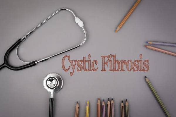 Cystic Fibrosis. Colored pencils and a stetoscope on the table