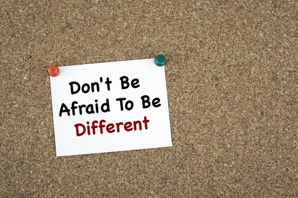 Don\'t Be Afraid To Be Different. Sticky note on cork board