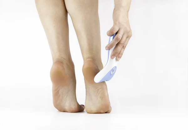 Woman Filing Foot With Foot File