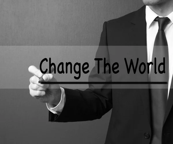 Business man writing: Change The World