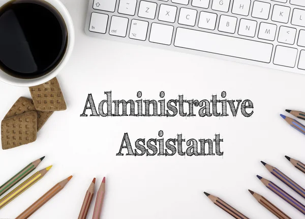 Administrative Assistant. On white office desk computer keyboard