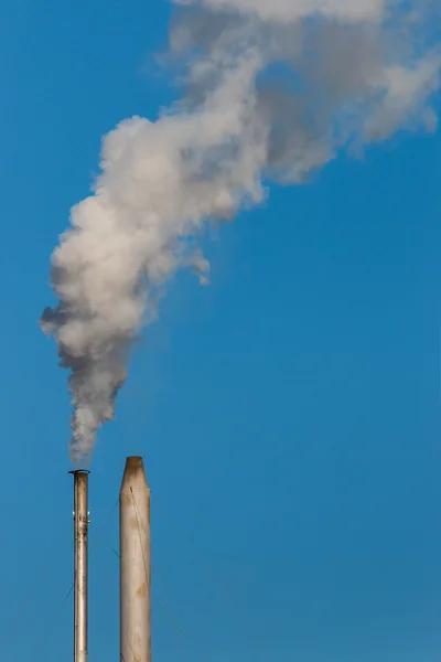 Factory chimneys with smoke