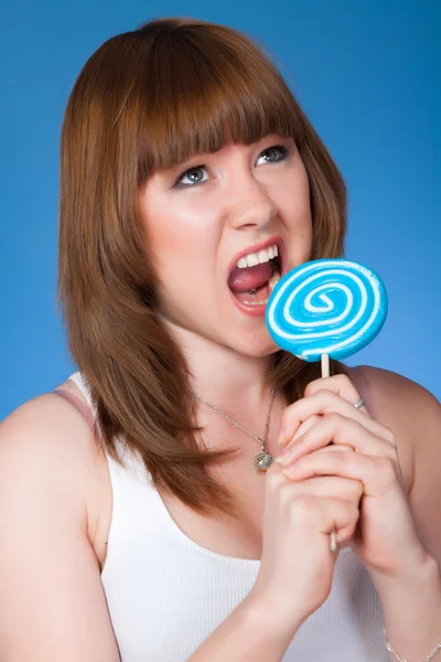 Beautiful blonde girl on a light background