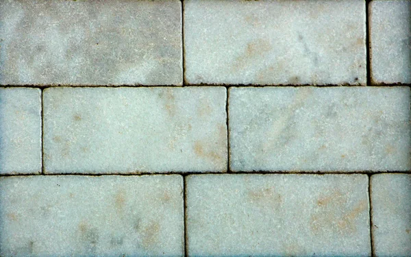 Multicolored marble bricks close-up, sample, background