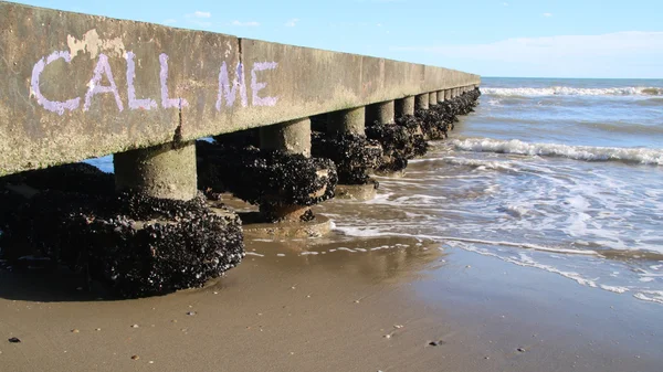 Call me written on the beach