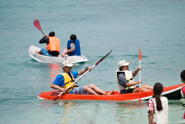 People on a kayaks