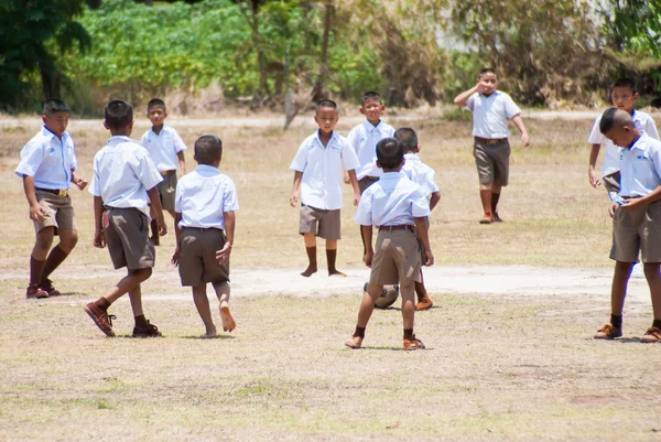 Thai children play football