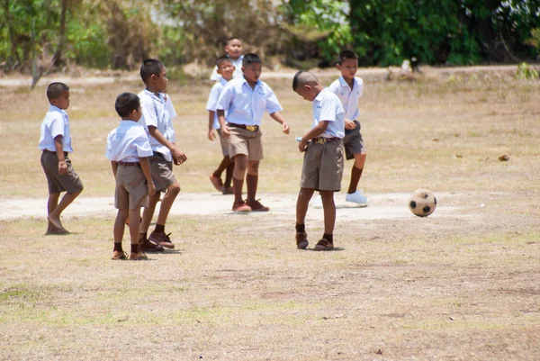 Thai children play football