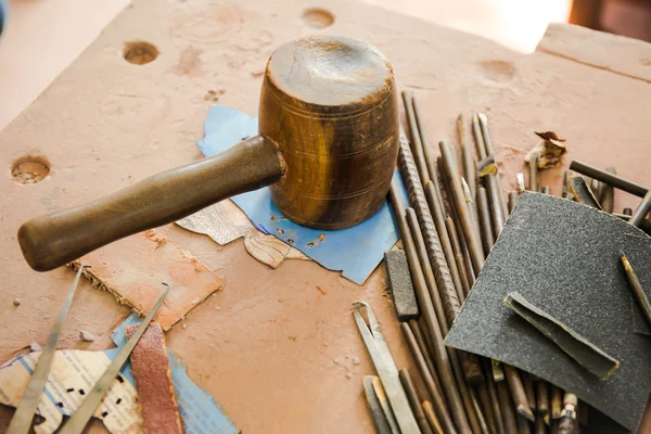 Various kinds of Sculpting Tools laying down on dirty wooden table